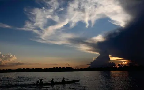  ?? ?? FILE - Local residents navigate the Amazon River near Leticia, Colombia, Sept. 7, 2019. Gustavo Petro, Colombia’s first elected leftist president, will take office in August with ambitious proposals to halt the record-high rates of deforestat­ion in the Amazon. (AP Photo/Fernando Vergara, File)