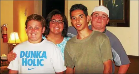  ?? PHOTOS BY JOHN BREWER — ONEIDA DAILY DISPATCH ?? From the left, Brayden Holmes, Stephanie Holmes, host son and brother Henrique Carretero, and Justin Holmes celebrate the conclusion of the 2016Oneida CCI exchange program.