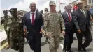  ??  ?? Turkish Chief of Staff, General Hulusi Akar and Somali Prime Minister Hassan Ali Khayre tour a newly-opened TurkeySoma­li training center in 2017. Turkey has continued to provide military support in Somalia, including training soldiers