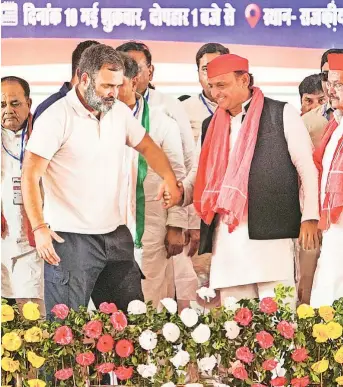  ?? PTI ?? HAND IN HAND: Congress leader Rahul Gandhi and Samajwadi Party president Akhilesh Yadav during a rally for the Lok Sabha polls in Kanpur on Friday.