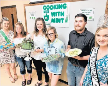  ?? PHILIP POTEMPA/POST-TRIBUNE PHOTOS ?? Winners of the 2019 Cooking with Mint Contest are Cathy Carlisle, of North Judson, second from left, Nathan Upchurch, of Knox, Cari Spaulding, of Lafayette, and Catherine Linderman, of North Judson, all framed by royalty with Mint Festival Queen Maggie Emery, far left and Miss Indiana State Festival Queen Madison Millick of Linton, Indiana, far right.