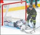  ?? The Associated Press ?? Richard W. Rodriguez
Kraken goalie Philipp Grubauer pokes the puck away from Stars center Sam Steel in Dallas’ 3-1 victory Saturday.