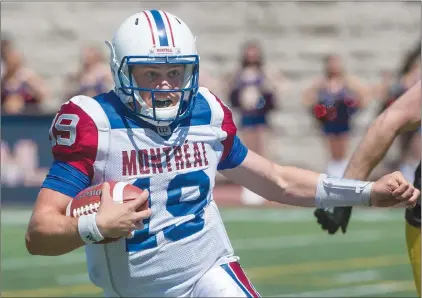  ?? CP PHOTO ?? Montreal Alouettes quarterbac­k Garrett Fugate carries the ball against the Hamilton Tiger-cats during second half preseason action in Montreal.