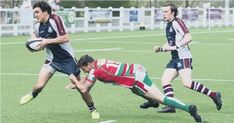  ??  ?? Tom Harrison dashes away from a Keighley opponent (above) and Scarboroug­h stalwart Paul Taylor powers over (below)