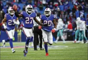  ?? RICH BARNES - THE ASSOCIATED PRESS ?? Buffalo Bills cornerback Tre’Davious White (27) celebrates with teammates Micah Hyde (23) and Shareece Wright (20) after intercepti­ng a pass during the second half of an NFL football game against the Miami Dolphins, Sunday, Dec. 17, 2017, in Orchard Park, N.Y. The Bills won 24-16.