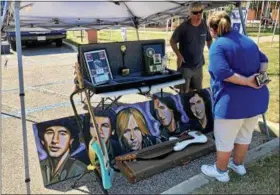  ?? TAWANA ROBERTS– THE NEWS-HERALD ?? The Eastlake Music Festival on July 15 featured Tom Petty memorabili­a, along with performanc­es by Shadow of Doubt, a tribute band.