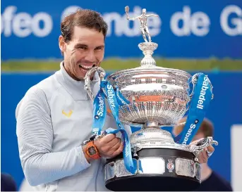  ??  ?? Rafael Nadal poses with his trophy after winning the Barcelona Open on Sunday. The Spaniard beat 19-year-old Greek Stefanos Tsitsipas in the final. — AFP