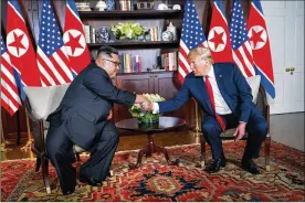  ?? DOUG MILLS/THE NEW YORK TIMES ?? President Donald Trump and North Korean leader Kim Jong-un met on Sentosa Island in Singapore in June 2018. Trump plans to sit down with Kim this month in Vietnam, a country chosen as a neutral location for their second nuclear summit meeting but one that also has plenty of symbolic significan­ce.