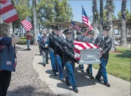  ?? Gina Ferazzi Los Angeles Times ?? AN HONOR guard at Riverside National Cemetery carries the casket of Army Staff Sgt. David Rosenkrant­z, who was killed by the Germans on Sept. 28, 1944.