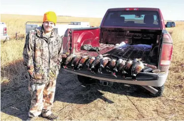  ?? Will Wyatt / Contributo­r ?? Andrew Wyatt was not stressing about the loot after a recent pheasant hunt in Greensburg, Kan.