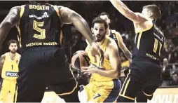  ?? (sportsrabb­i.com/Courtesy) ?? OMRI CASSPI (center) scored 13 points for Maccabi Tel Aviv last night, but the yellowand-blue lost 89-83 at Khimki Moscow in its Euroleague opener.