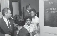  ?? Arkansas Arts Center Foundation Collection: Gift of the artist/WILL COUNTS ?? Lawyer Thurgood Marshall, later a U.S. Supreme Court justice, leaves a court session along with several Little Rock Nine students in 1957.