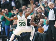  ?? MICHAEL DWYER / AP ?? San Antonio Spurs' Brandon Paul tries to beat Boston Celtics' Marcus Smart during the third quarter of Monday’s game in Boston. The Celtics won 108-94.