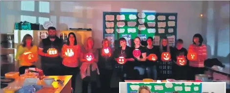  ??  ?? Attendees at the BYOPumpkin event show off their illuminate­d pumpkin creations.