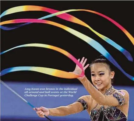  ??  ?? Amy Kwan won bronze in the individual all-around and ball events at the World Challenge Cup in Portugal yesterday.