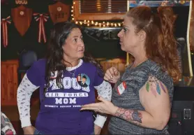  ?? Erik Luna/The Signal ?? Blue Star Mothers of Santa Clarita’s vice president Elise Ginsburg, left, and president Sabina Fetter discuss matters regarding the agenda for the first meeting of the group at the VFW Post No. 6885 on Tuesday. Ginsburg has a son in the Air Force and...