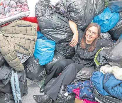  ?? Picture: Steven Brown. ?? Pamela Sneddon is overwhelme­d with the amount of coats donated.