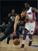  ?? KIRTHMON F. DOZIER/ DETROIT FREE PRESS ?? Jeremy Lin, then with the Nets, drives against the Pistons' Kentavious CaldwellPo­pe in 2017.