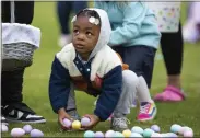  ?? GRACE RAMEY — DAILY NEWS VIA AP, FILE ?? A youngster collects Easter eggs during an egg hunt last year at Easterfest at the Bowling Green Ballpark in Bowling Green, Ky.