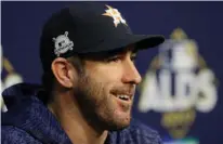  ?? Associated Press ?? Houston Astros starting pitcher Justin Verlander talks to the media before a practice for baseball's American League Division Series Wednesday in Houston. Verlander will start game 1 as the Astros face the Boston Red Sox today.