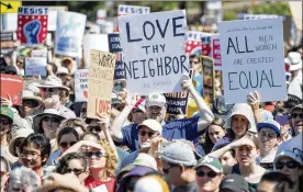  ?? JOSH EDELSON / ASSOCIATED PRESS ?? ABOVE: People hold up signs and shout while listening to speakers during a “Rally Against Hate” in Berkeley, Calif., on Sunday.