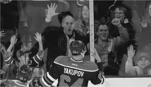  ?? IAN JACKSON/ THE CANADIAN PRESS ?? Nail Yakupov, the Edmonton Oilers’ No. 1 overall draft pick in 2012, holds up three fingers to fans at Rexall Place to indicate his hat trick in the third period of Saturday’s NHL game against the Vancouver Canucks. The Oilers drafted first each of the...