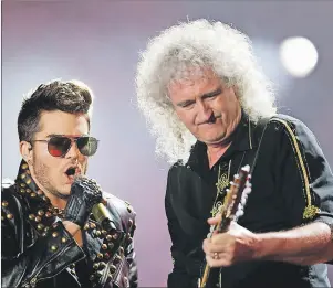  ?? AP PHOTO ?? Adam Lambert, left, and Brian May of the Queen + Adam Lambert perform in September 2015 at the Rock in Rio music festival in Rio de Janeiro, Brazil. May says he’s proud to still be part of the live touring tradition of rock shows.