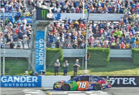  ?? THE ASSOCIATED PRESS ?? Kyle Busch crosses the finish line to win Sunday’s NASCAR Cup Series event at Pocono Raceway in Long Pond, Pa.