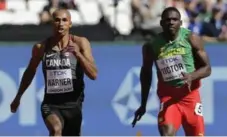  ?? DAVID J. PHILLIP/THE ASSOCIATED PRESS ?? Canadian Damian Warner leads Lindon Victor of Grenada and the rest of the field in the 100-metre portion of the decathlon, clocking 10.50 seconds.