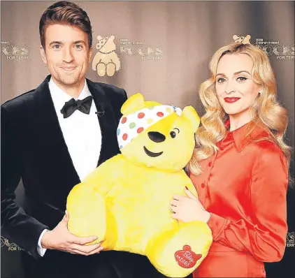  ??  ?? Greg James, Fearne Cotton and Pudsey at a Children in Need fundraiser in London last November