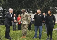  ?? Carlos Avila Gonzalez / The Chronicle ?? Gil Sanborn, aide to the Army secretary, with Staff Sgts. Isaiah Locklear (left) and Michael Marl and Spc. Mariel Young.