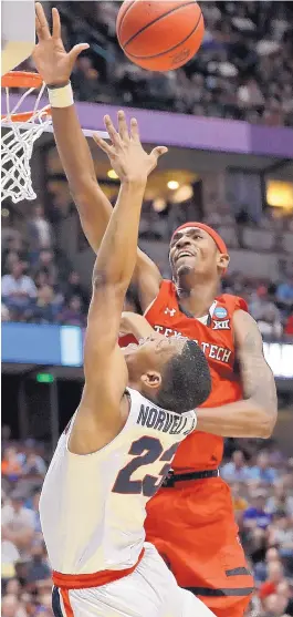  ?? MARCIO JOSE SANCHEZ/ASSOCIATED PRESS ?? Texas Tech forward Tariq Owens, rear, blocks a shot by Zach Norvell Jr. in the second half. Owens also had a critical block in the final minute as the Red Raiders earned their first Final Four berth.