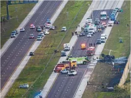  ?? ANDREW WEST/THE NEWS-PRESS ?? Two pilots were killed in small plane crash on Interstate 75 in Naples near Exit 105 on Feb. 9.