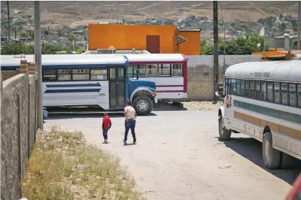  ??  ?? ABOVE: Catarina, an indigenous woman from Guatemala, and a child walk outside of El Buen Pastor, a migrant shelter in Ciudad Juárez, Mexico. She’s seeking asylum in the United States, awaiting a court date in December. But her wait may be in vain.