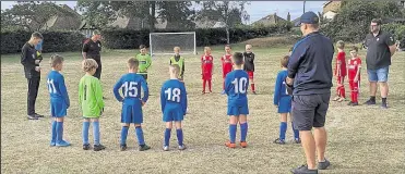  ??  ?? Under-8 Lightning pay their respects to Trevor Twyman before their match at Whitstable