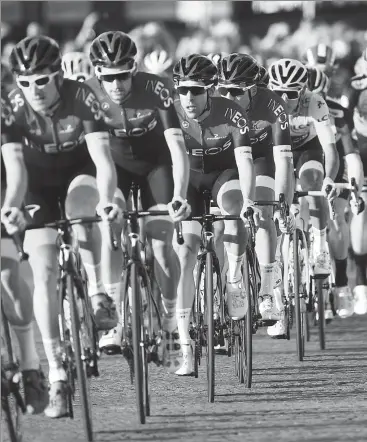  ?? GETTY IMAGES ?? Team INEOS riders, including race leader Egan Bernal (in yellow jersey), cruise over the Champs Elysees cobbleston­es during the final stage of last year’s Tour de France in Paris on July 28. Organizers plan to this year’s race from Aug 29-Sept 20 after it was reschedule­d due to the coronaviru­s pandemic, although it remains to be seen whether spectators will be allowed to line the course as usual.