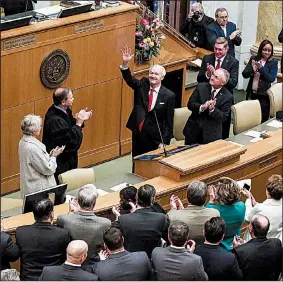  ?? Arkansas Democrat-Gazette/MITCHELL PE MASILUN ?? Gov. Asa Hutchinson acknowledg­es the applause Tuesday after his swearing-in ceremony in the House chamber. “Today, we have a budget that allows for tax cuts while investing in the future,” Hutchinson said in his State of the State Address that followed. “We have demonstrat­ed that we can do it, and we will do it again.”