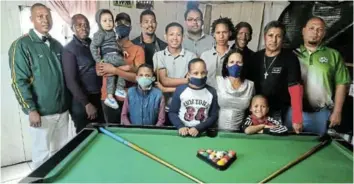  ?? Picture: ETHIENNE ARENDS ?? PIONEER: Sella Doyle, in front with blue mask, officially opened her pool academy last week in Parkside. Pictured are some of the children at the academy and their mentors.