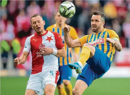  ?? FOTO MAFRA – MICHAL SVÁČEK ?? Slavia a Opava jsou v opačných částech tabulky, pro oba týmy je však velmi důležité, jak bude případné pokračován­í ligy vypadat