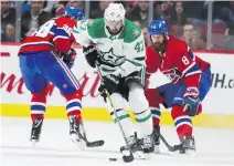  ?? JOHN MAHONEY ?? Alexander Radulov spins away from Jordie Benn, right, and Nikita Scherbak Tuesday night in his return to the Bell Centre with Dallas.