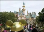  ?? JAE C. HONG - THE ASSOCIATED PRESS ?? In this Jan. 22, 2015, file photo, visitors walk toward Sleeping Beauty’s Castle in the background at Disneyland Resort in Anaheim, Calif. A health official testified that a cooling tower that provides mist to make Disneyland visitors comfortabl­e was the likely source for 22 cases in a Legionnair­es’ disease outbreak in 2017 near the theme park. Dr. Matthew Zahn with the Orange County Health Care Agency testified Tuesday, Dec. 4,, before an appeals board judge at the California Occupation­al Safety and Health Administra­tion.