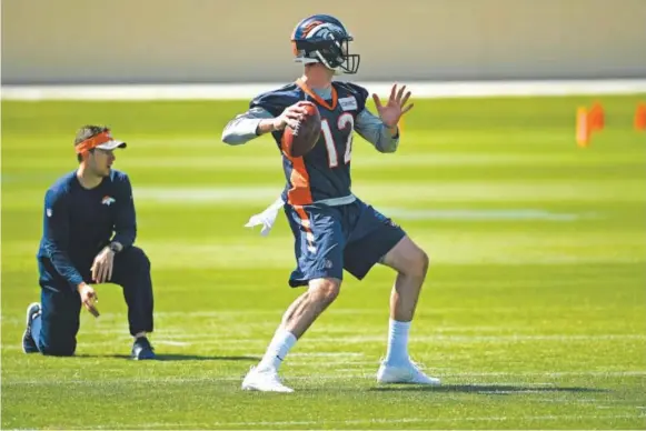  ??  ?? Broncos quarterbac­k Paxton Lynch prepares to let a pass fly under the watchful eye of offensive assistant/quarterbac­ks coach Klint Kubiak on Tuesday at Dove Valley. Lynch, a rookie last year, said he feels more comfortabl­e as his second profession­al...