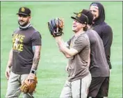  ?? Robert Gauthier Los Angeles Times ?? PADRES inf ielder Jake Croneworth and teammates at Globe Life Field prepare for the NLDS.