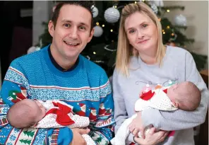  ?? Pictures: MERCURY PRESS ?? Proud parents Mick and Suzy at home with their twins Elizabeth and Etta