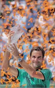  ??  ?? WINNING SERVICE RESUMED: Roger Federer after winning the Miami Open. ERIK S LESSER/EPA