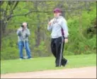  ?? PHOTOS BY SAM STEWART — DIGITAL FIRST MEDIA ?? Pottsgrove’s JP Norris watches as Cori Dickinson bats during the Falcons’ loss to Spring-Ford.