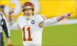  ?? Keith Srakocic The Associated Press ?? Alex Smith’s return to the field has seen a resurgence in the Washington Football Team’s fortunes. After a 1-5 start, the team is 3-1 since Smith took over as the starting quarterbac­k.