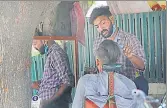  ??  ?? ■
A roadside barber giving a haircut without wearing a face mask at Sector 33, Chandigarh, on Friday. KESHAV SINGH/HT