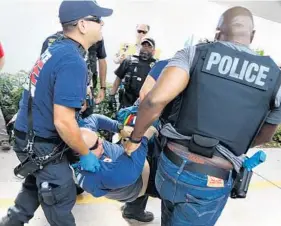  ?? CARLINE JEAN/STAFF PHOTOGRAPH­ER ?? Members of the Margate-Coconut Creek Fire Rescue and the Margate Police Department­s take part in a regional active shooter training drill at Margate Elementary School.