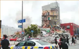  ?? Rex Features ?? Far left: The former central police station damaged in the 2011 earthquake is demolished in Christchur­ch, New Zealand. It is collapsing buildings that cause the most casualties, not the earthquake itself.